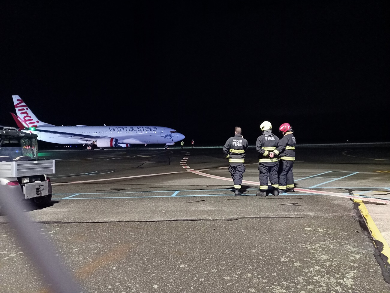 Firefighters at the scene following the safe landing at Invercargill Airport. Photo: Toni McDonald