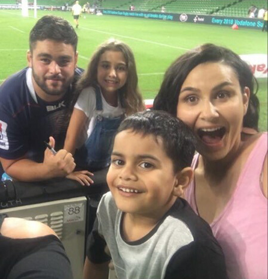 Ainsley (left) celebrates with family members (from right) his sister Whitney Aholelei and her...