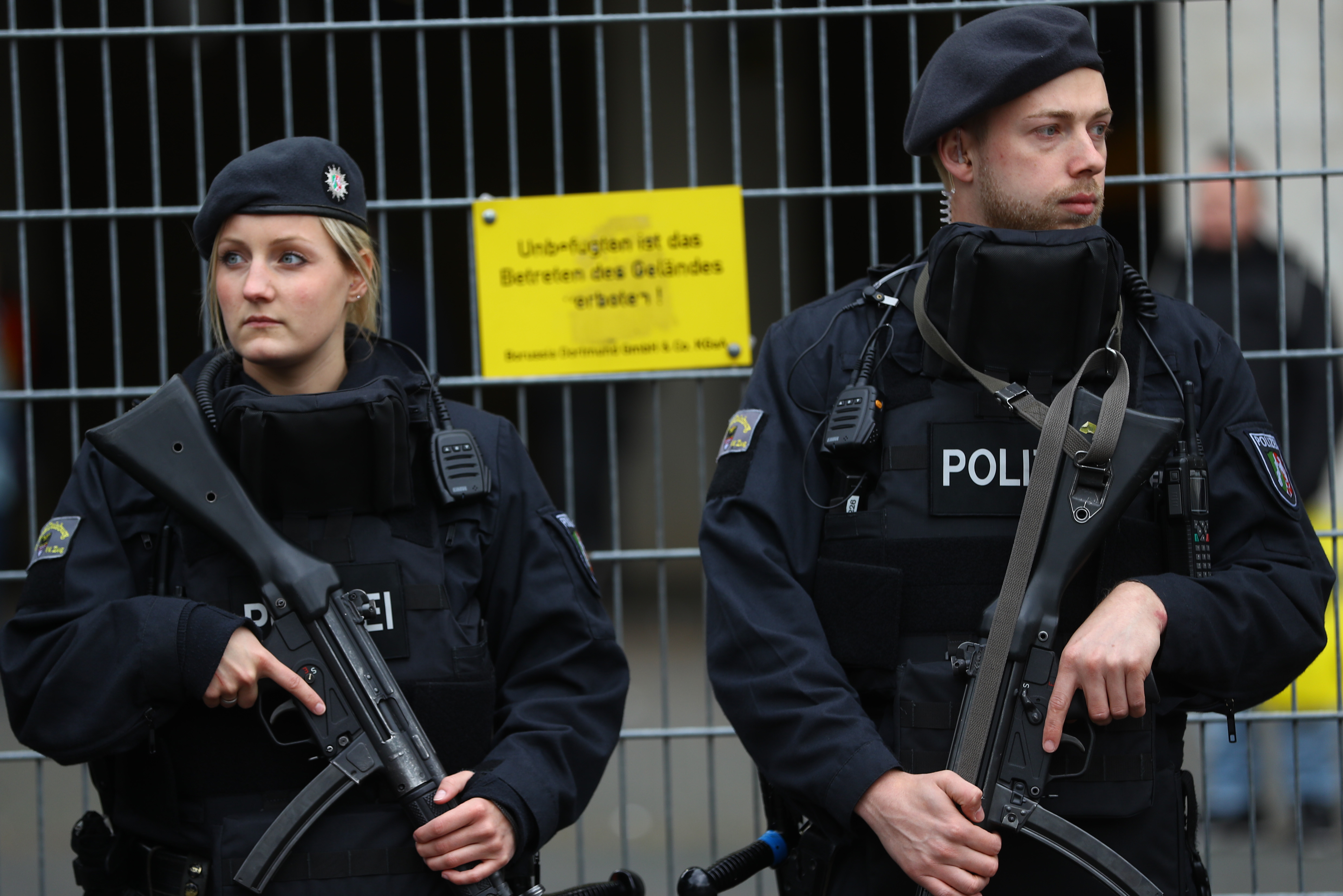 Police stand guard outside the stadium before the match. Photo: Reuters / Livepic