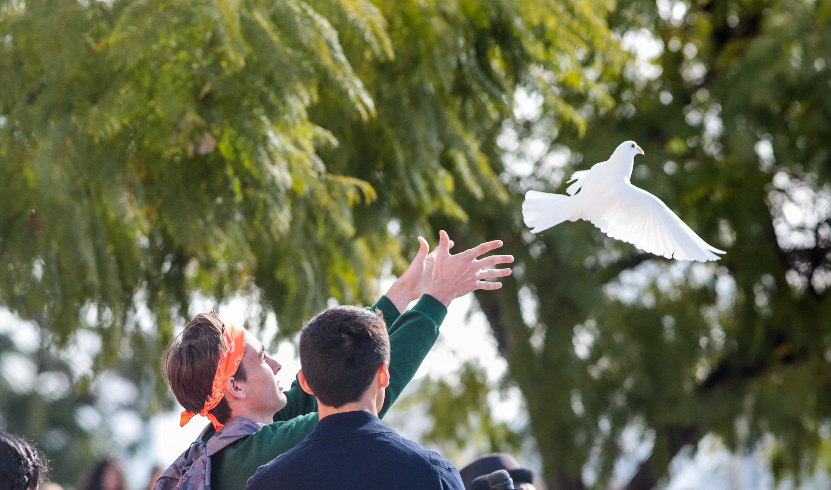 Students released 17 white doves outside Crescenta Valley High School as part of the National...