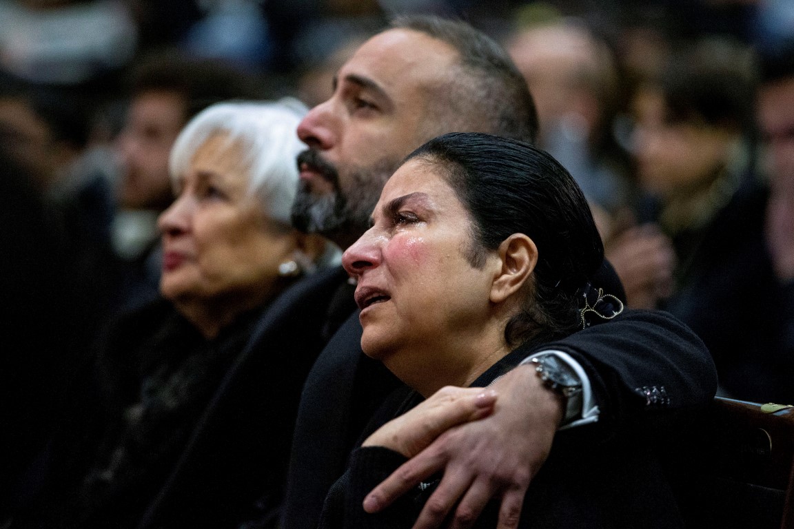 Mourners in Toronto, Canada, attend a memorial service for the victims after the plane was shot...