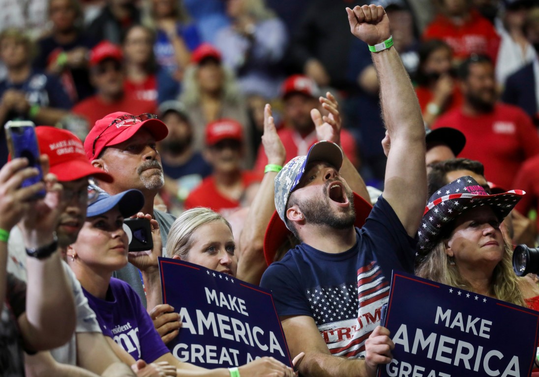 Supporters cheer as the president appears at the campaign rally. Photo: Reuters