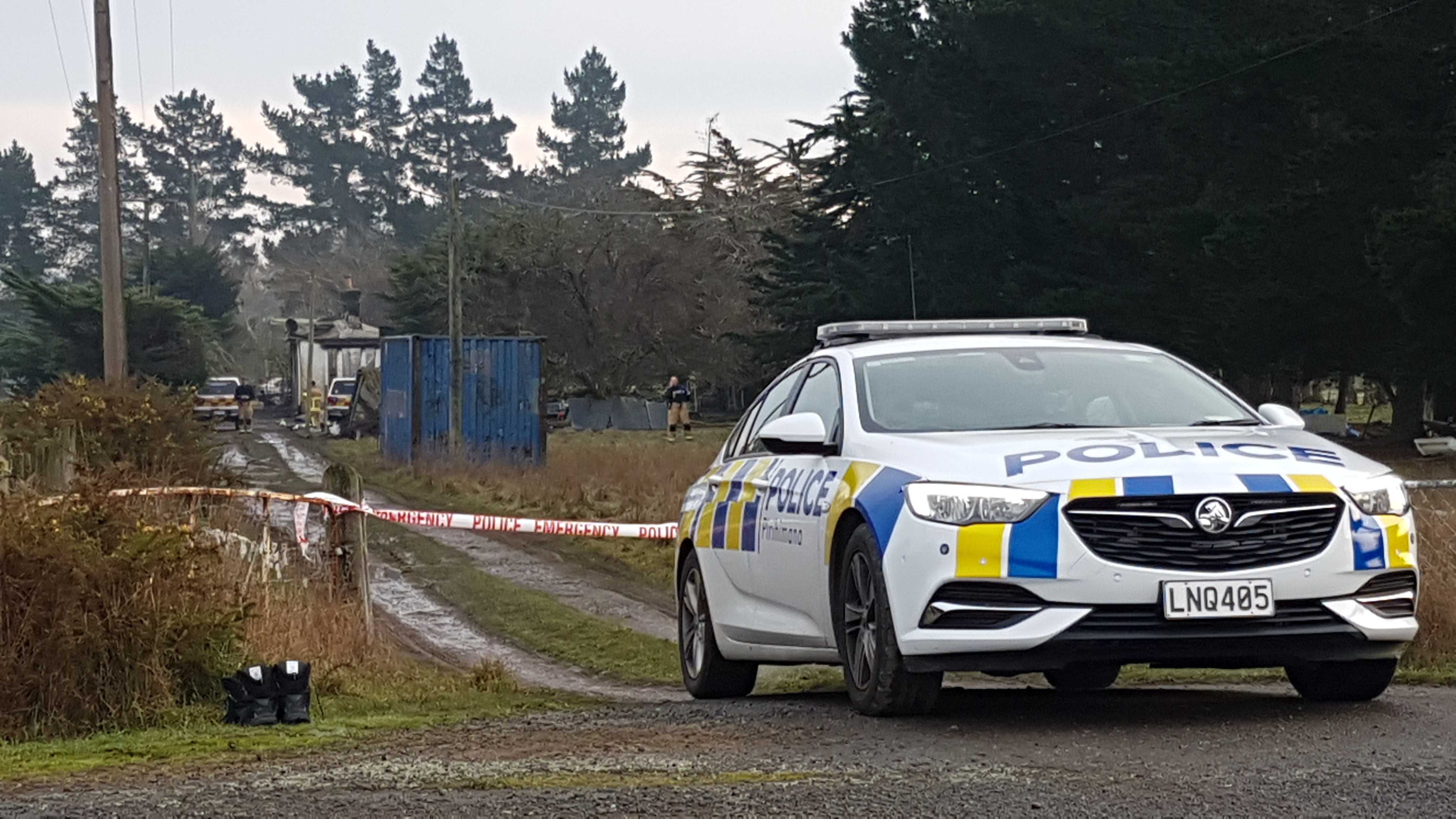 Fire investigators were at the McLeans Island property this morning. Photo: Geoff Sloan