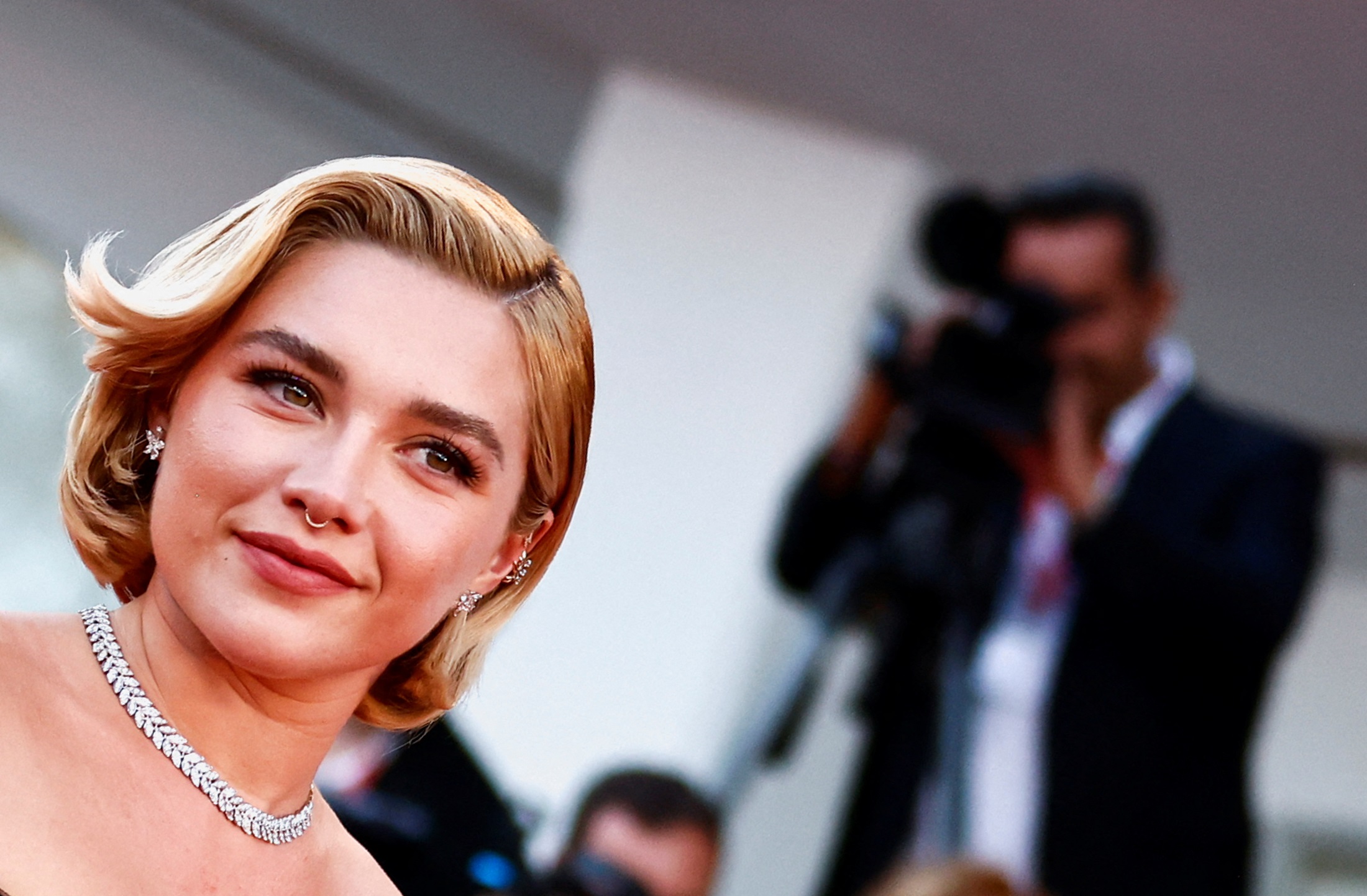 Florence Pugh plays a young housewife in the 1950s-set film alongside Harry Styles in his first...