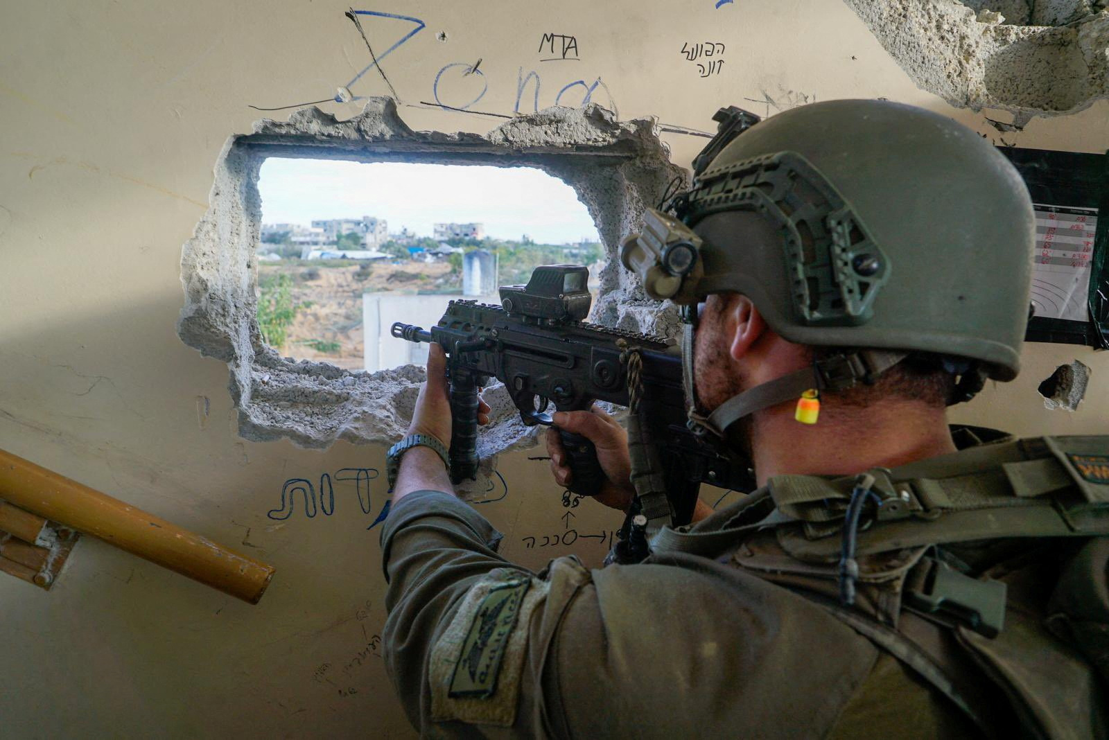 An Israeli soldier in the Gaza Strip after a temporary truce between Israel and the Palestinian...