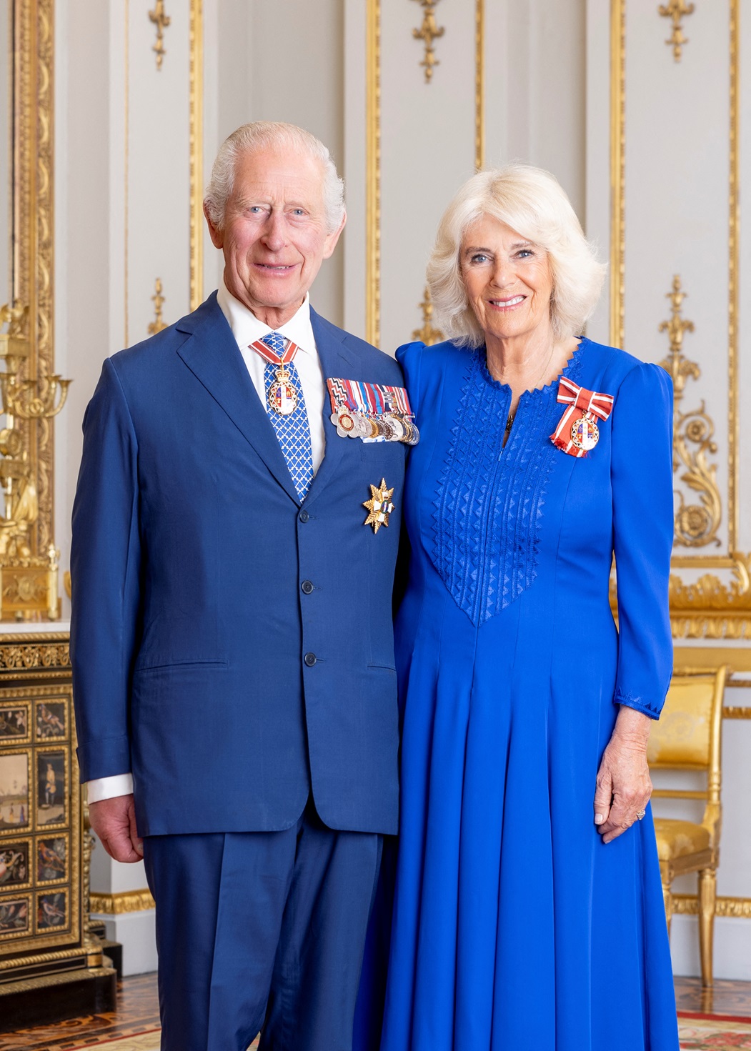 King Charles and Queen Camilla pose for a photo in Buckingham Palace in London. Photograph by...