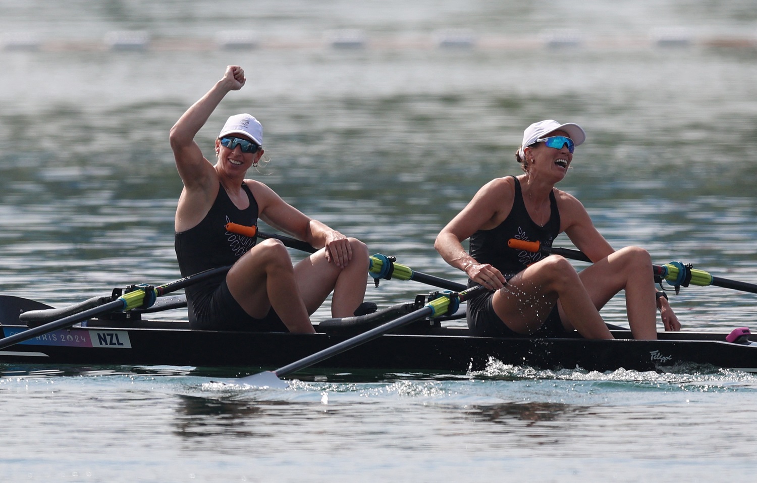 New Zealand's Brooke Francis and Lucy Spoors celebrate their victory in the women's double scull....