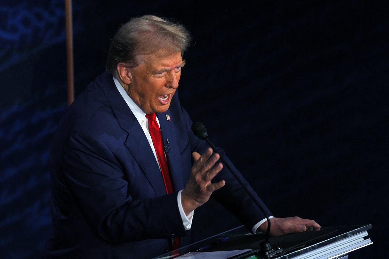 Donald Trump speaks during the debate. Photo: Reuters