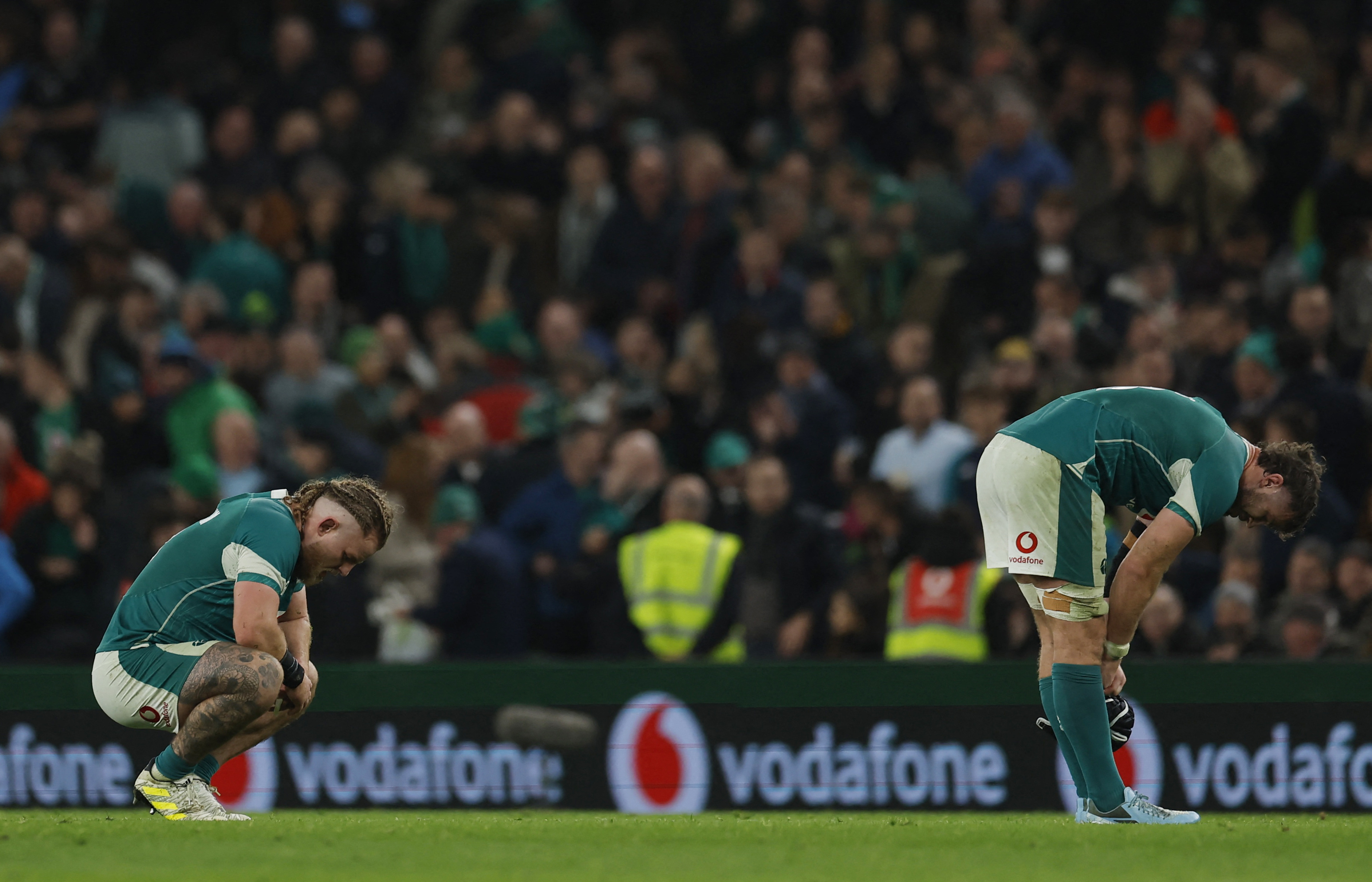 Dejected Ireland players after the match. Photo: Reuters 