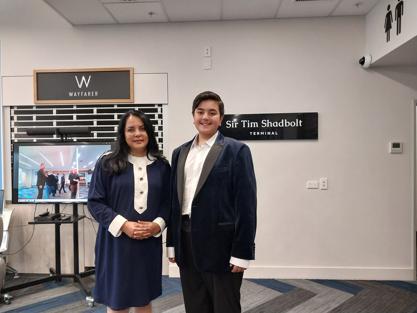 Sir Tim Shadbolt's partner Asha Dutt and son Declan, 12, at the ceremony at Invercargill Airport...