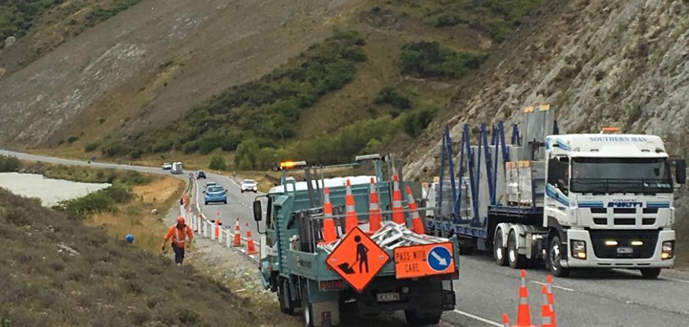 Road workers repair wire rope guard rails at the scene after the incident. Photo ODT