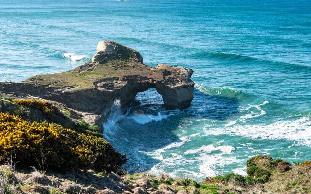 Tunnel Beach in Dunedin. Photo: Unsplash/Tonia Kraakman