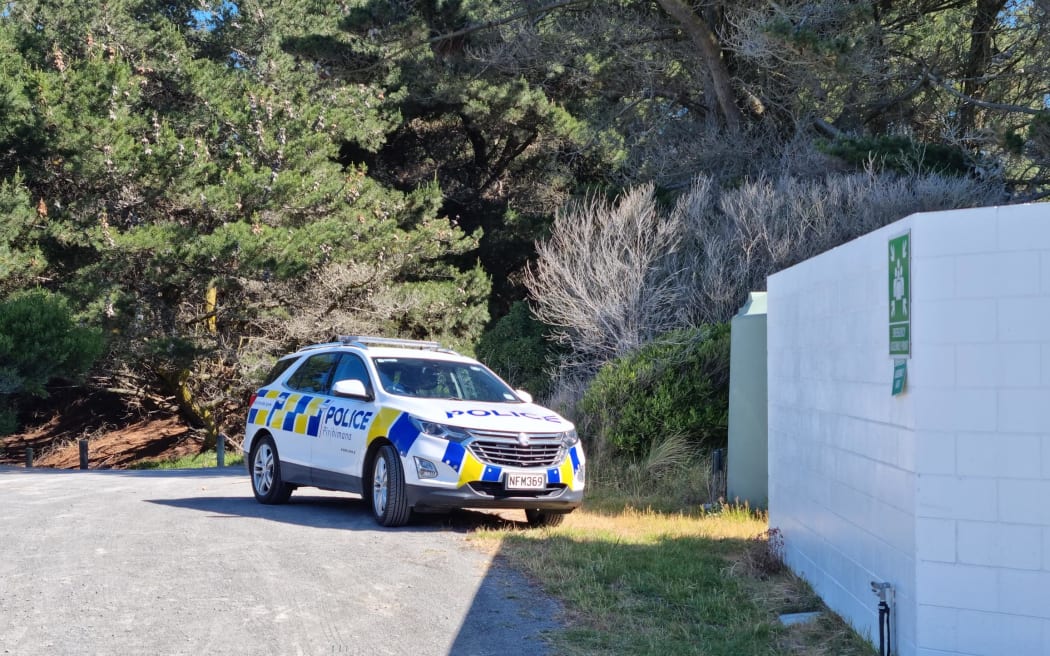 A police car is seen parked outside the Spencer Park Surf Life Saving Club east of Kaiapoi in...