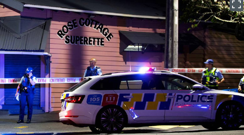 Police at the scene where a shopkeeper was fatally stabbed at the Rose Cottage Superette in...