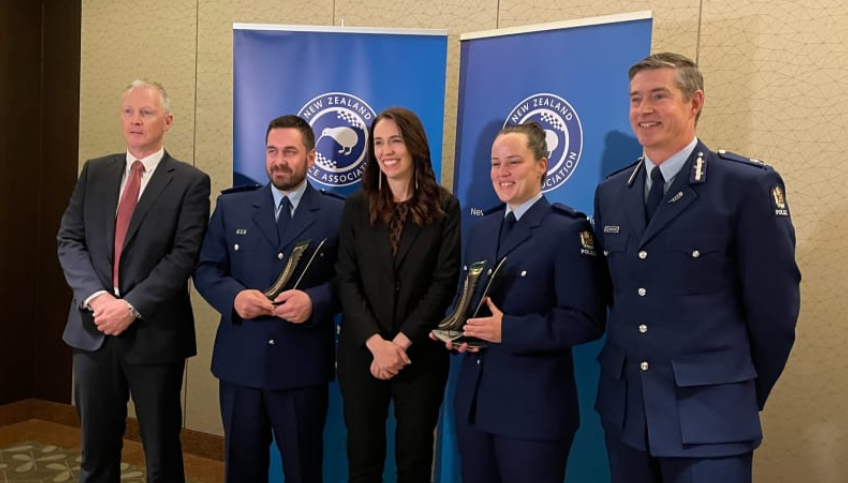 From left: NZ Police Association president Chris Cahill, Detective Constable Jeremy Toschi, Prime...