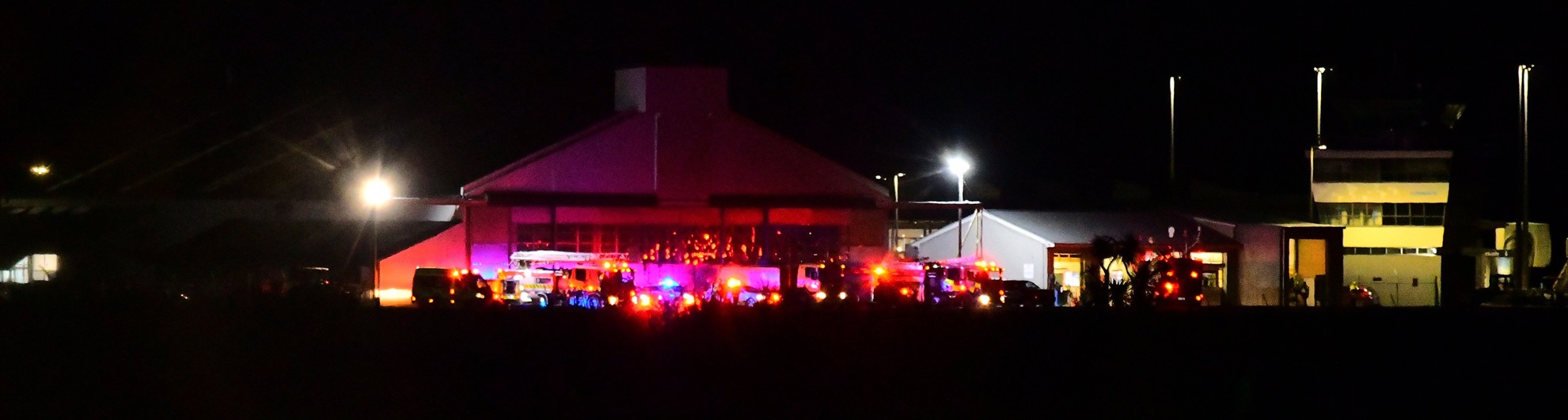 Emergency services wait for the flight to arrive at Invercargill Airport. Photo: Dave Loudon