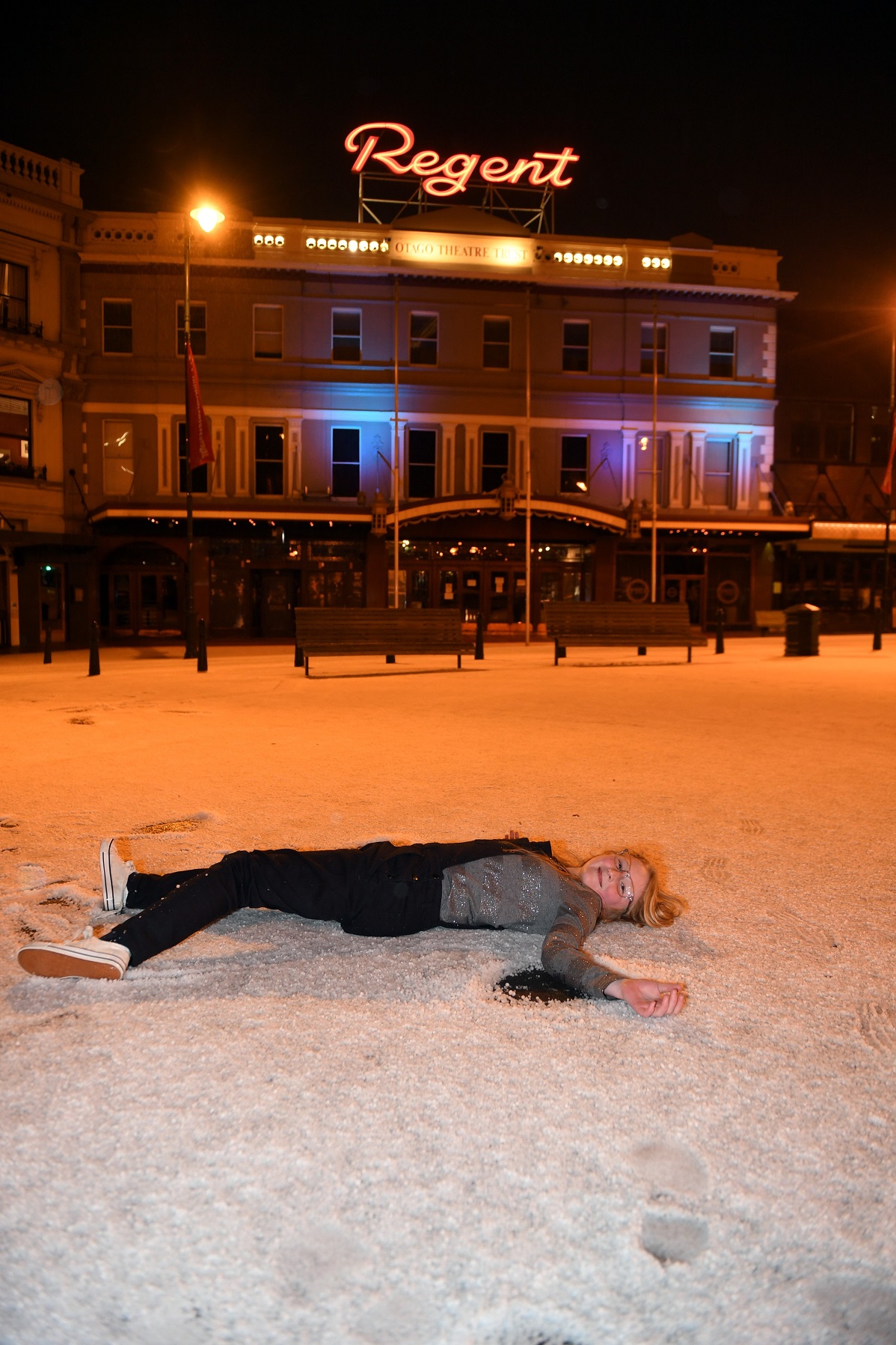 Lily Cotter (10) plays in the sudden layer of hail which coated Dunedin city streets just before...