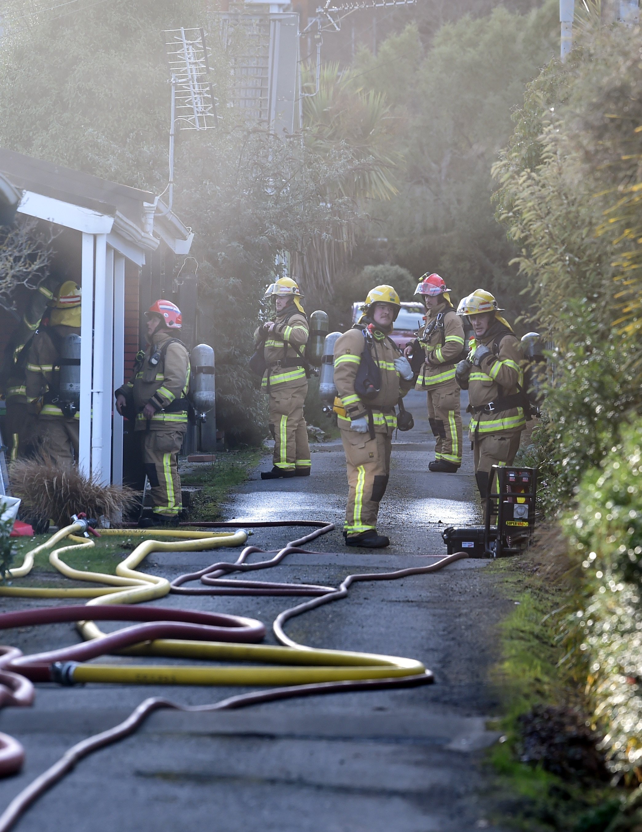 Firefighters at the scene of the blaze. Photo: Peter McIntosh