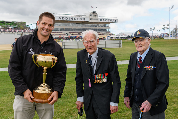 Richie McCaw delivers the New Zealand Trotting Cup alongside war veterans Neil Harton and Jack...