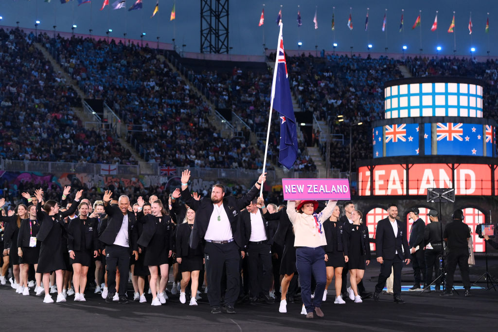 Tom Walsh and Joelle King (obscured) lead the New Zealand team out at Alexander Stadium. Photo:...