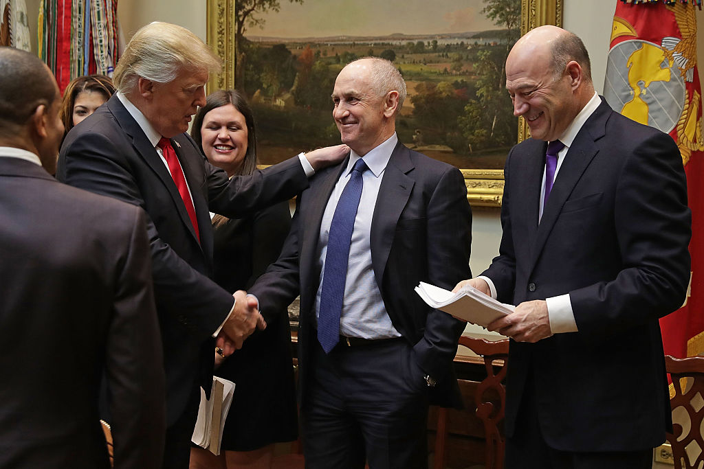 US President Donald Trump (L) with Chris Liddell (C) in 2017. Photo: Getty