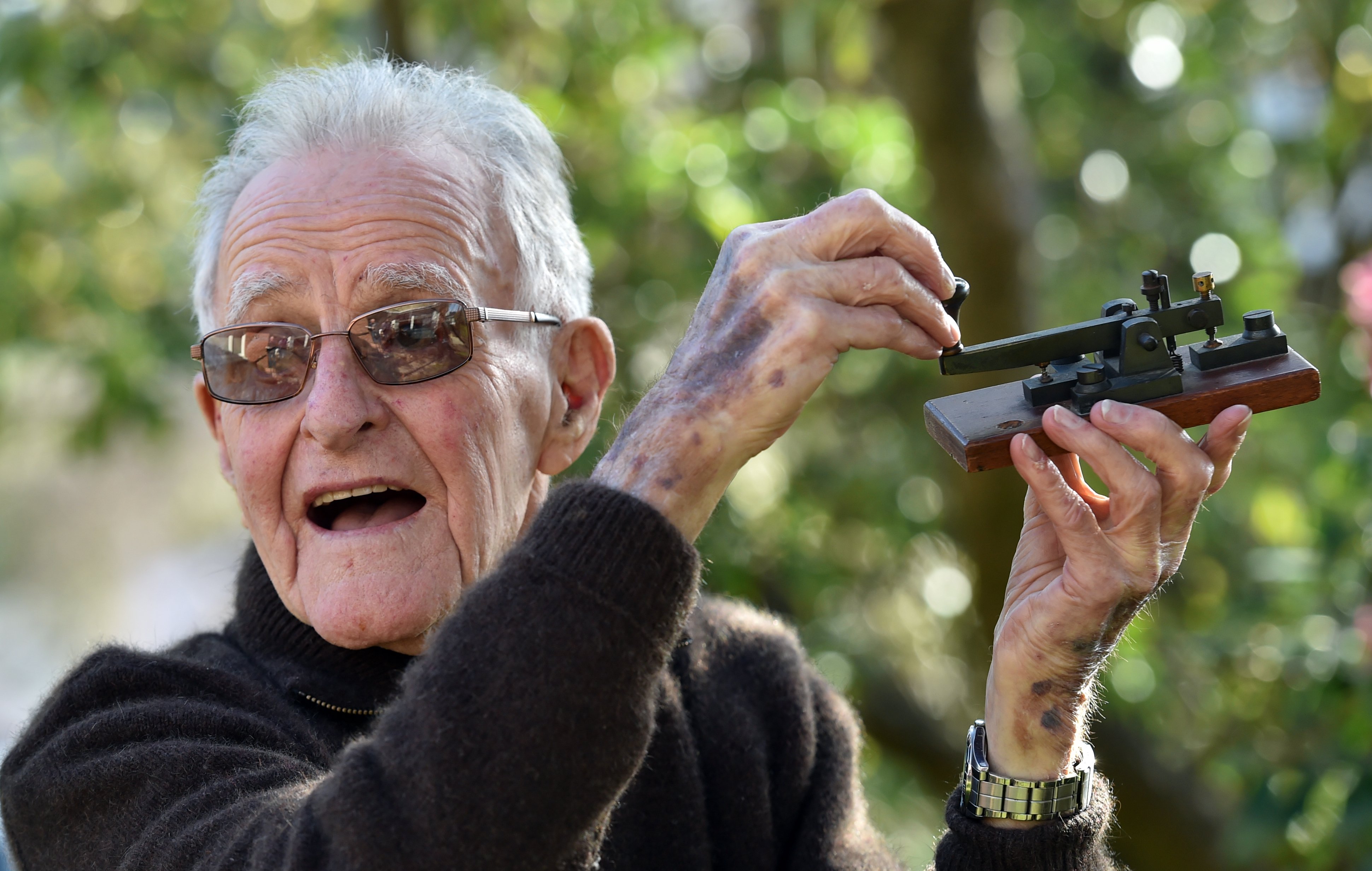 Former telegraph branch manager, Iain Graham (94), of Dunedin, with a Morse key of the type he...