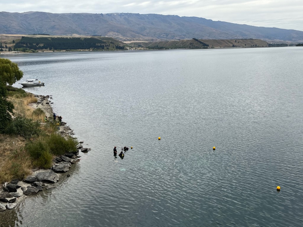 Police Dive Squad members in the water at Lake Dunstan. Photo: Shannon Thomson