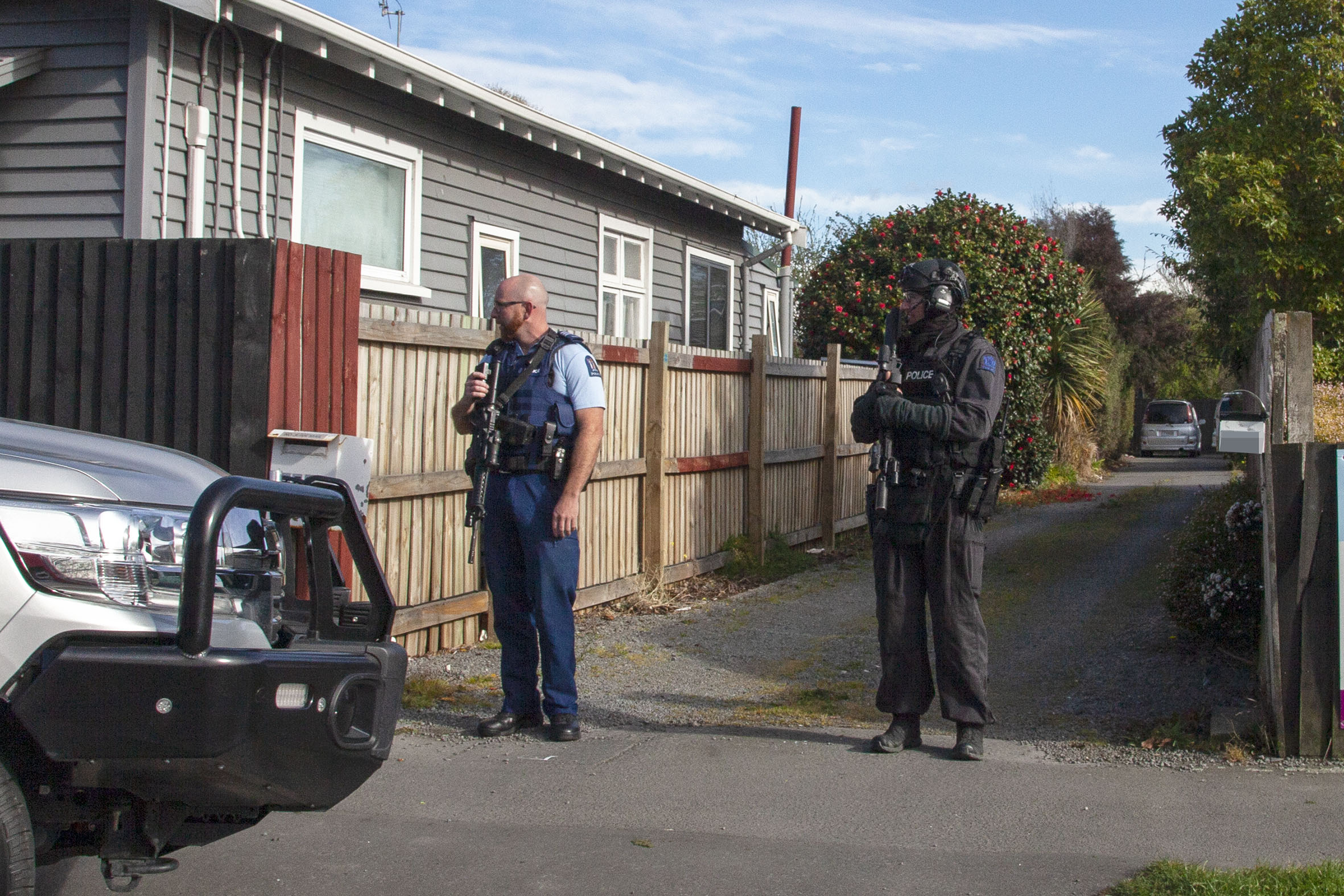 Police and a member of the AOS on Buckleys Rd. Photo: Geoff Sloan