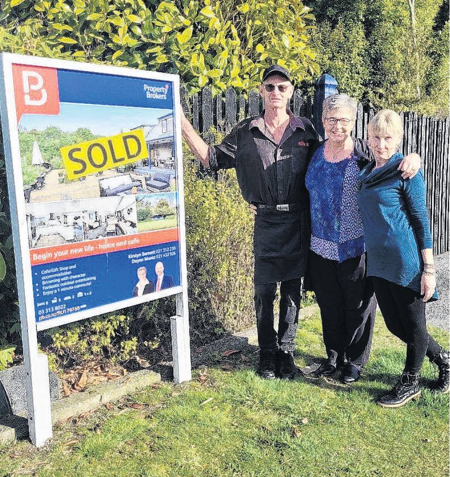 Annette and Steve Thomson, of Cust, with real estate agent Kirstyn Barnett, centre, have sold...