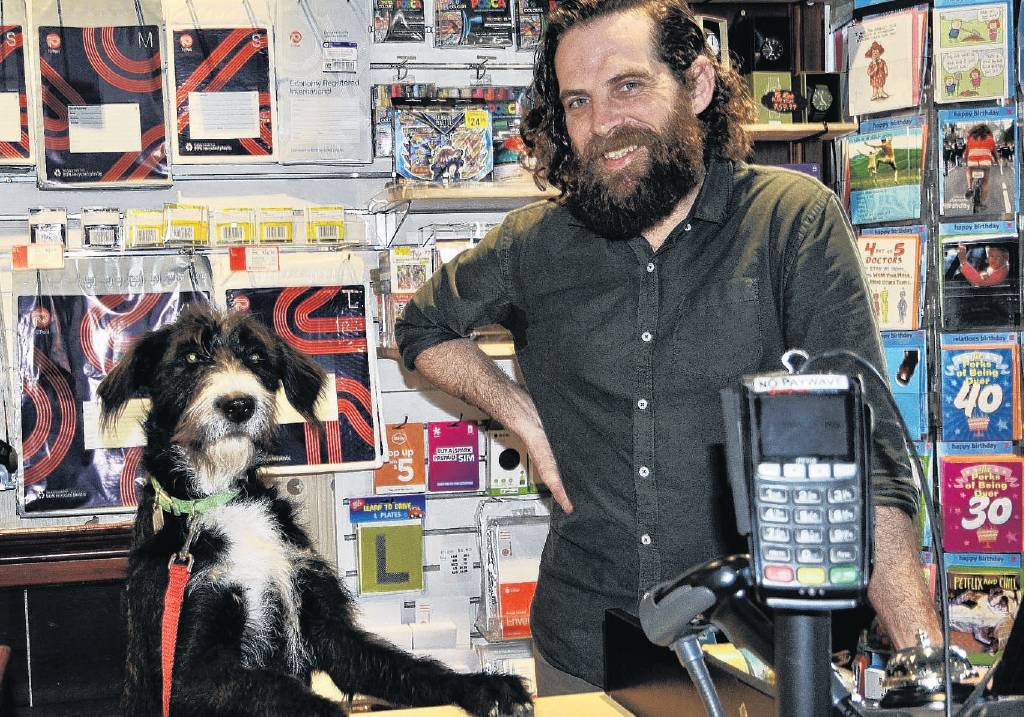 Kaiapoi Paper Plus owner Jared Raines with his bearded collie/huntaway cross Molly. PHOTO:...