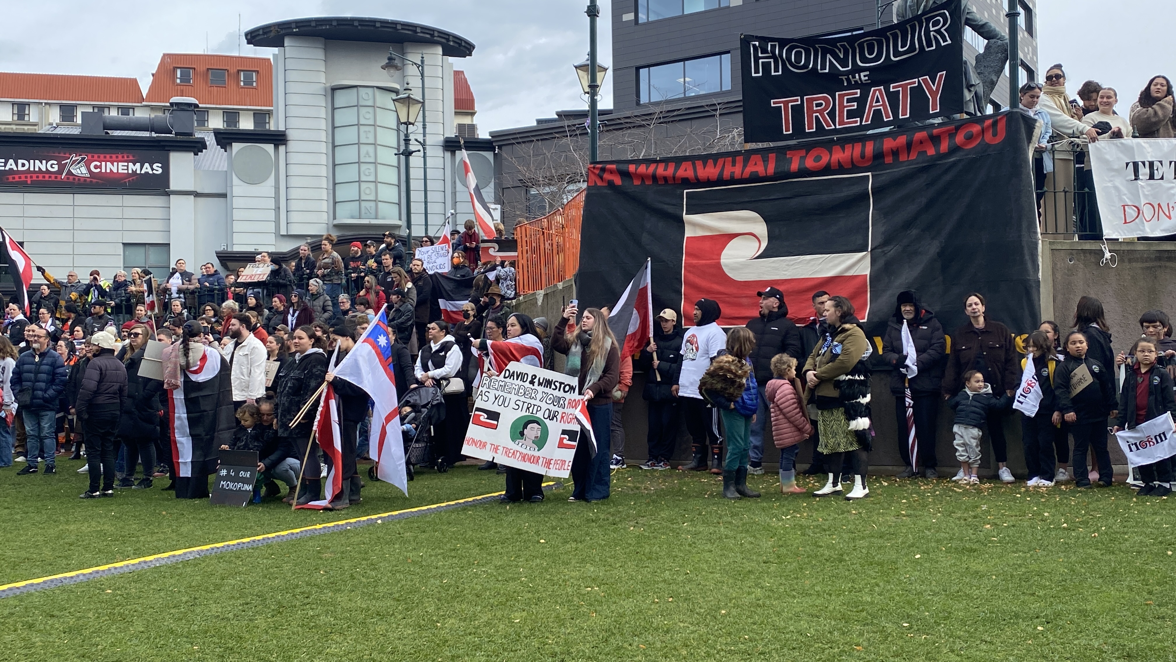 Protesters gather in the Octagon following the march. Photo: Craig Baxter