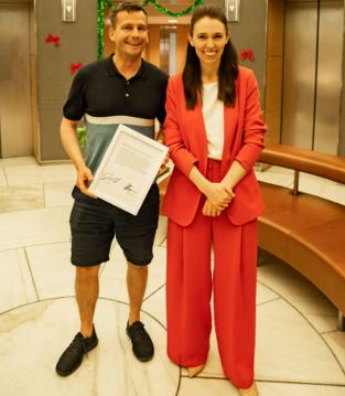 David Seymour and Jacinda Ardern autographed a printout of Parliament's Hansard recording of her...