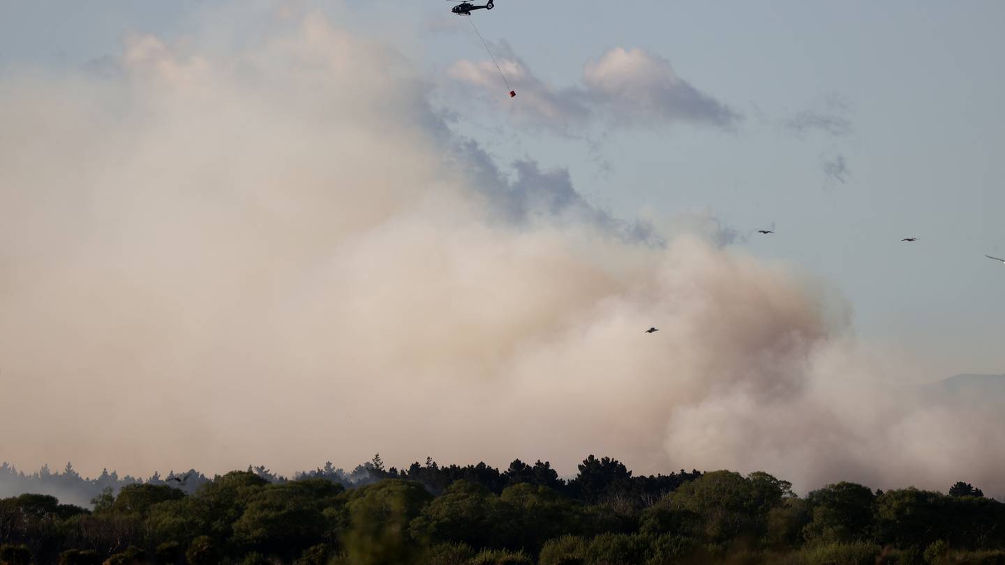 Helicopters with monsoon buckets have started to arrive on the scene to help fight the fire from...