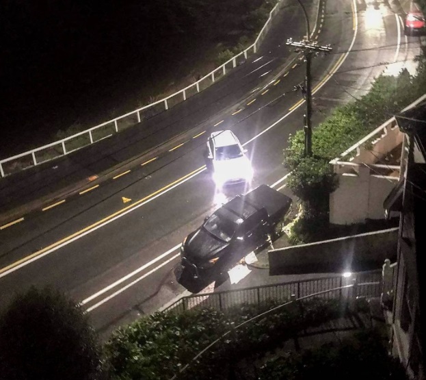 A white Hyundai Kona electric car driven by Kiri Allan sits on an angle, in the middle of Evans...