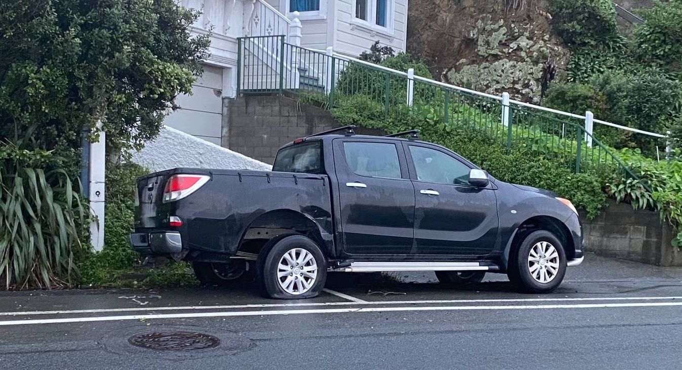 Damage can be seen on a ute parked on Evans Bay Parade after Sunday night's crash involving Kiri...