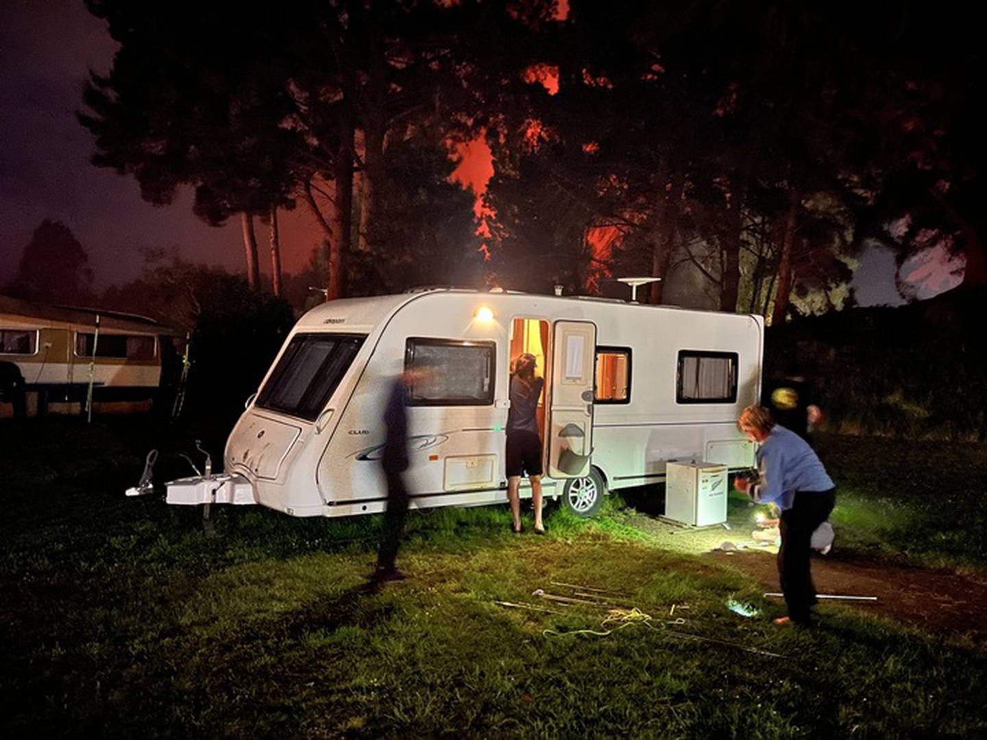 Campers rush to leave the Woodend Beach Holiday Park. Photo: Hamish Clark