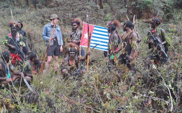 The West Papua National Liberation Army with Phillip Mehrtens. The flag is the Morning Star flag...