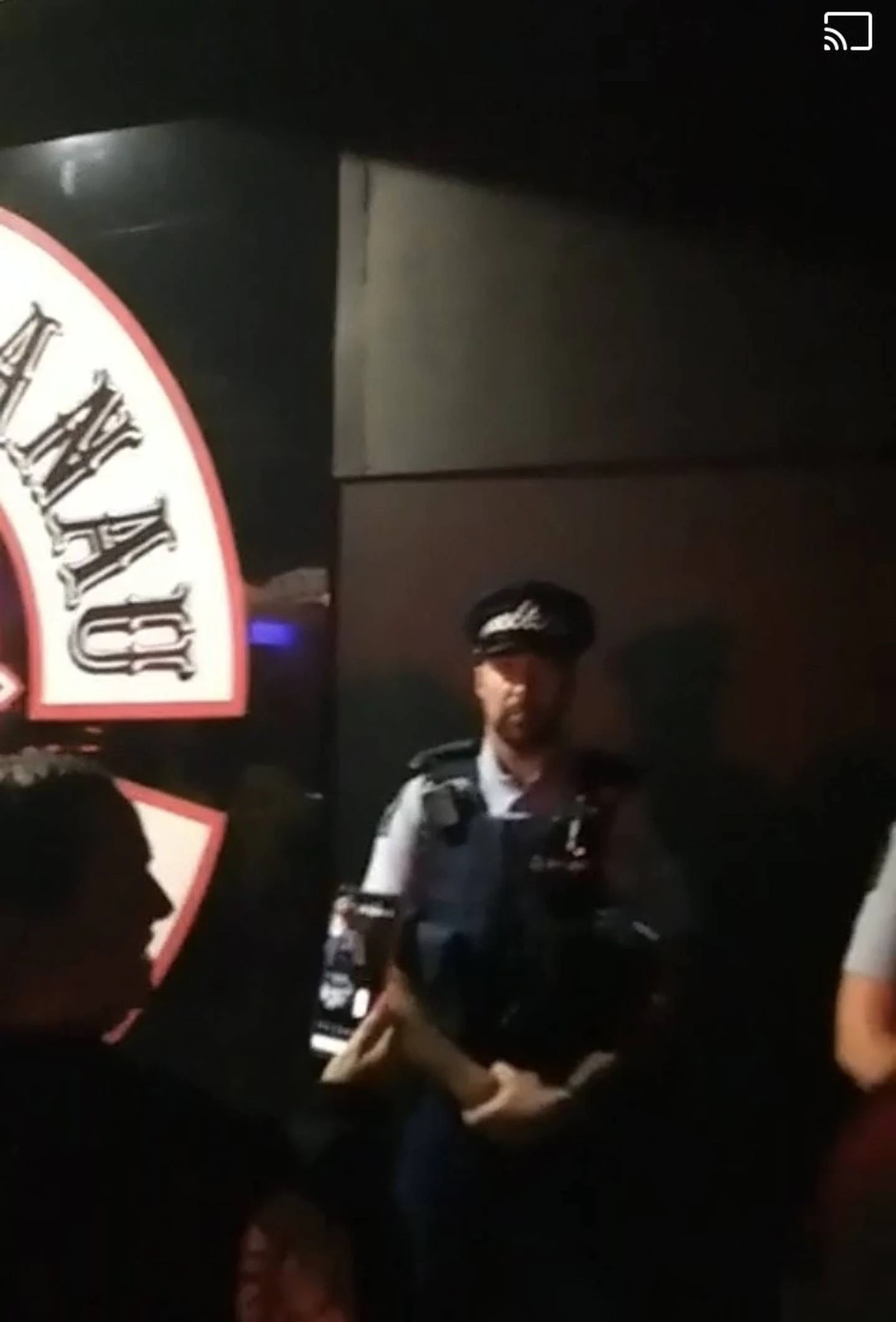 One of many police officers inside the Irondog premises during a combined Mongrel Mob birthday...