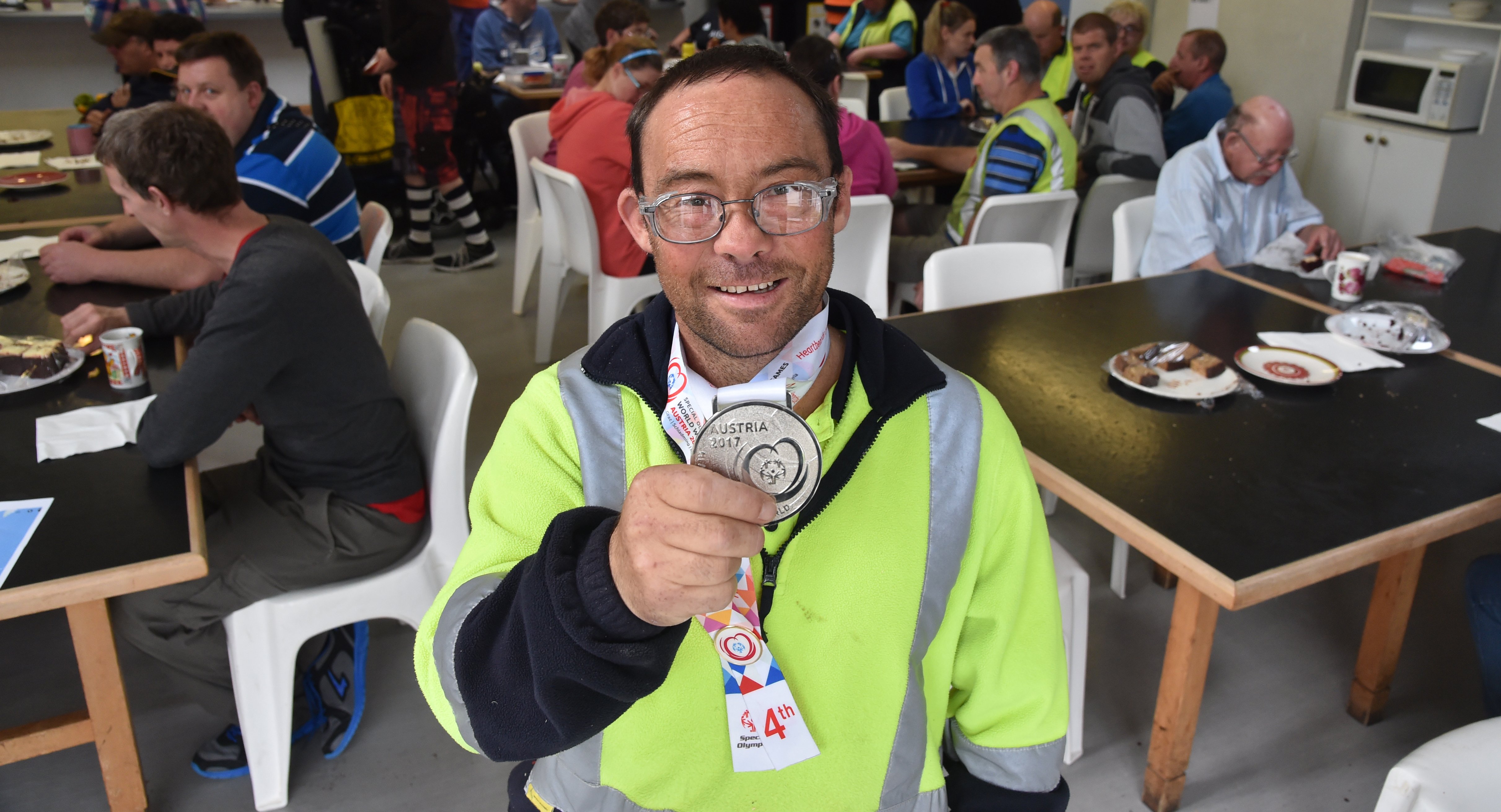 Silver-medal winning Special Olympic skier Nathan Symister returned to a hero's welcome at Cargill Enterprises. PHOTO: CRAIG BAXTER