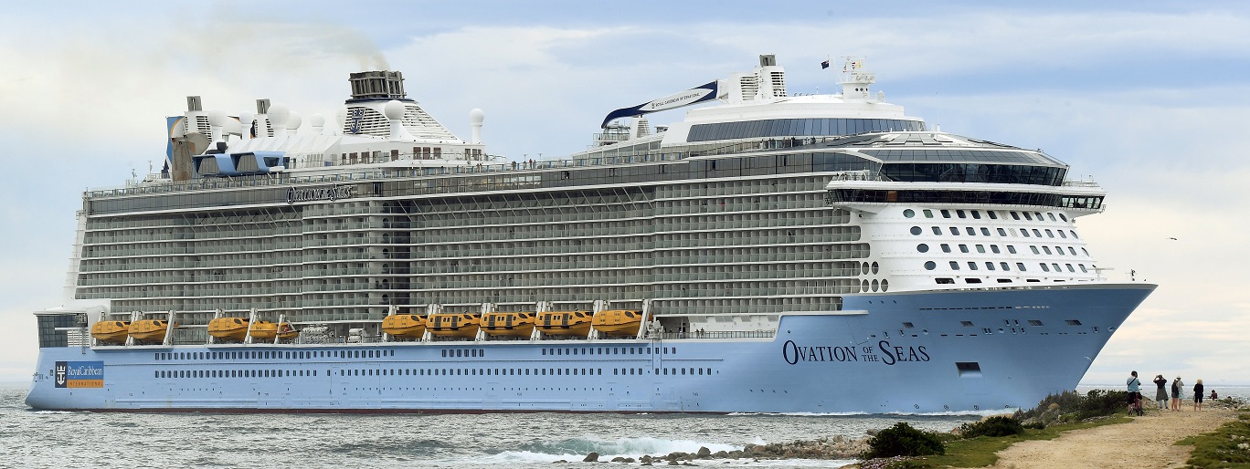 People watch from dry land as Ovation of the Seas makes its way to the shore of Dunedin yesterday...