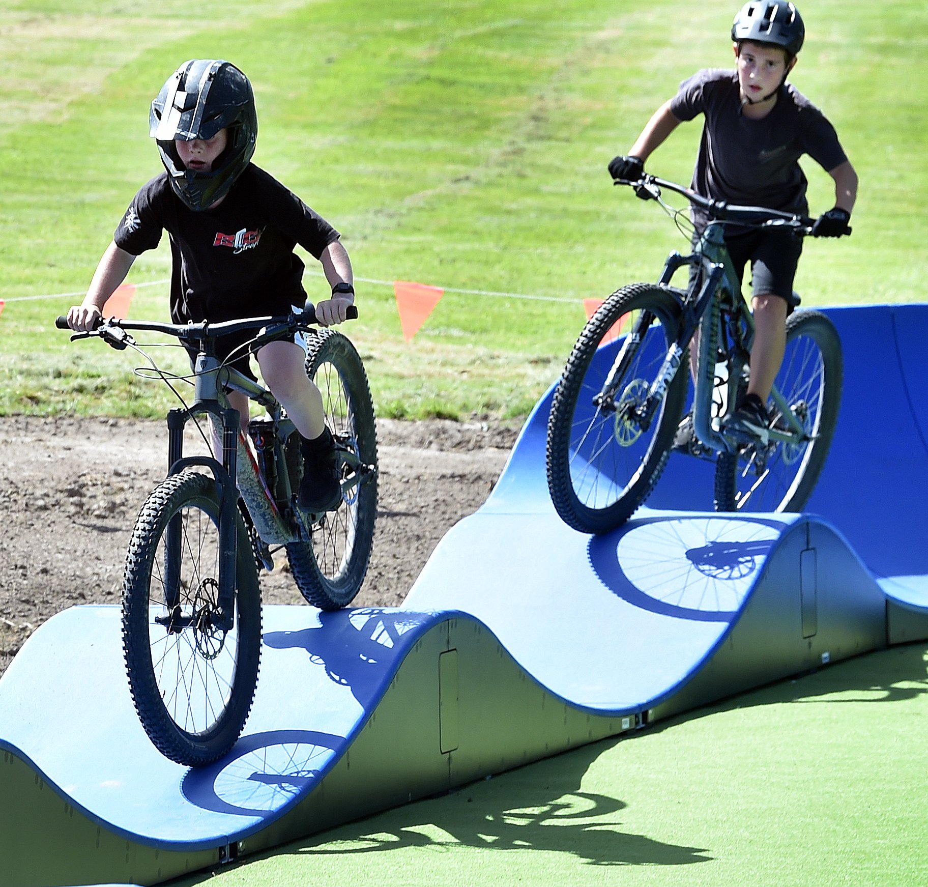 Riders Lenix Scott (left) and Macklin Ewing, both 10, in action at the track. 