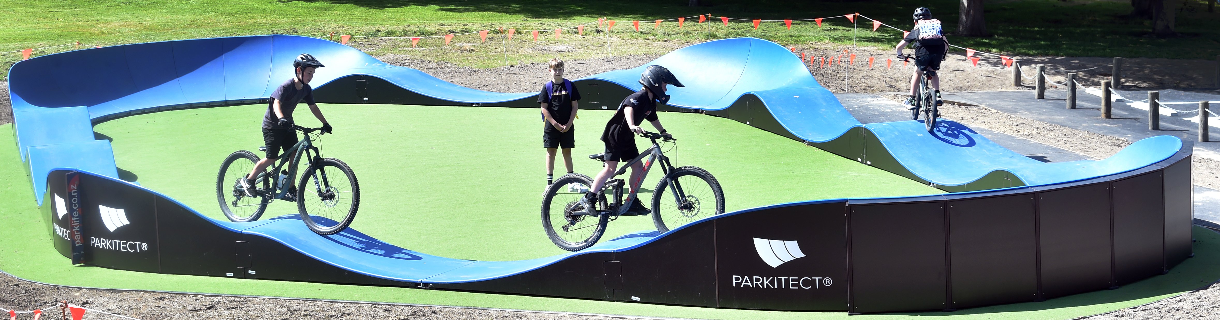 Riders try out the new Mayfield Ave playground pump track in Wakari yesterday. Photos : Peter...