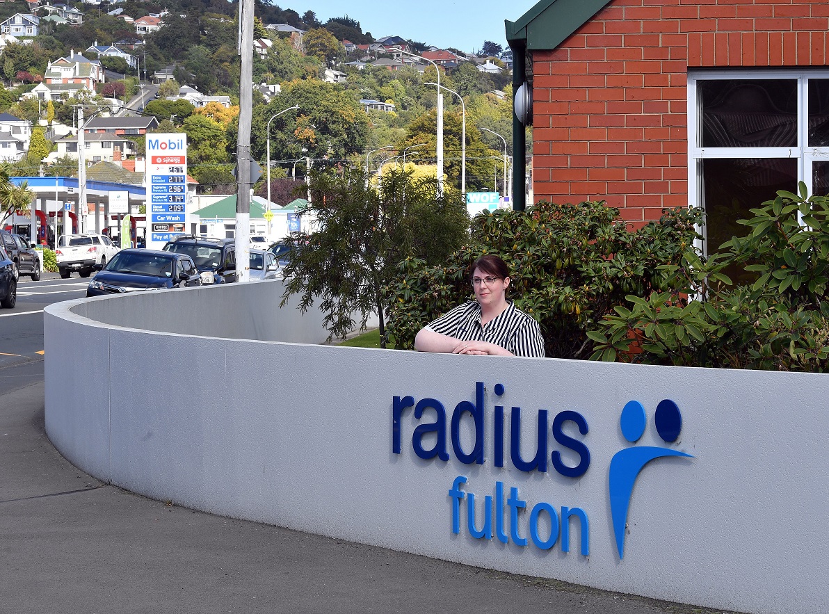 The radius fulton rest home manager Lisa Genge stands behind a flood wall built by the home after...