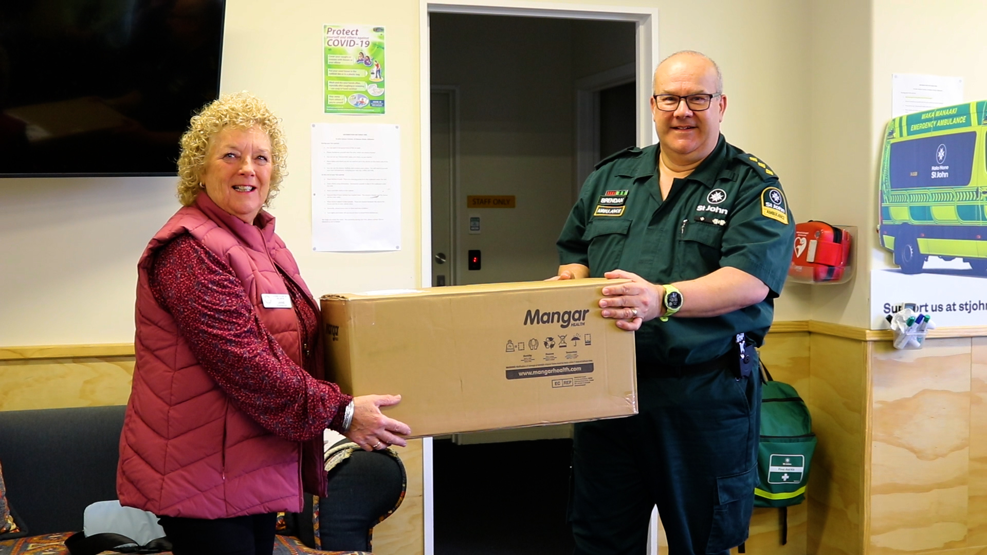 Jane Forrest handing the lifting cushion over to Brendan McInnes. Photo: Emily O'Hagan