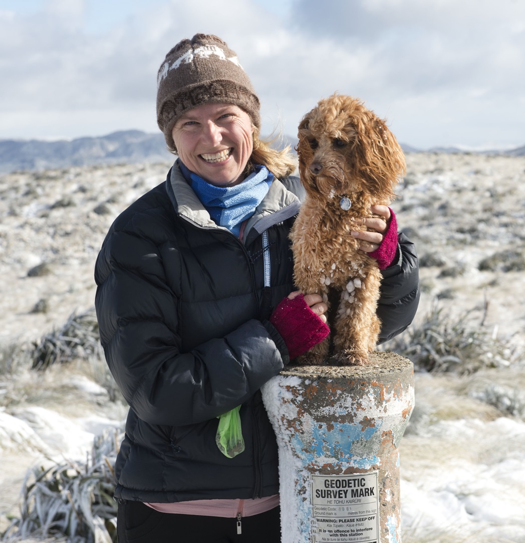 Jennifer Macleod and cavoodle Poppy enjoy the wintry view from the summit of Flagstaff on the...