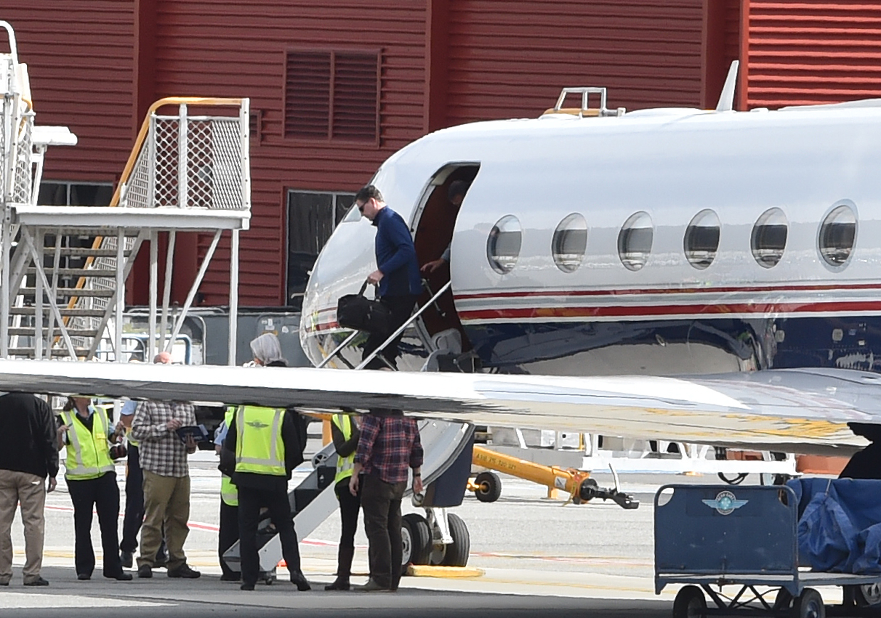 FBI director James Comey emerges from a Gulfstream G550 jet at Queenstown Airport yesterday to take part in a spy conference at the resort this week. Photo: Craig Baxter.