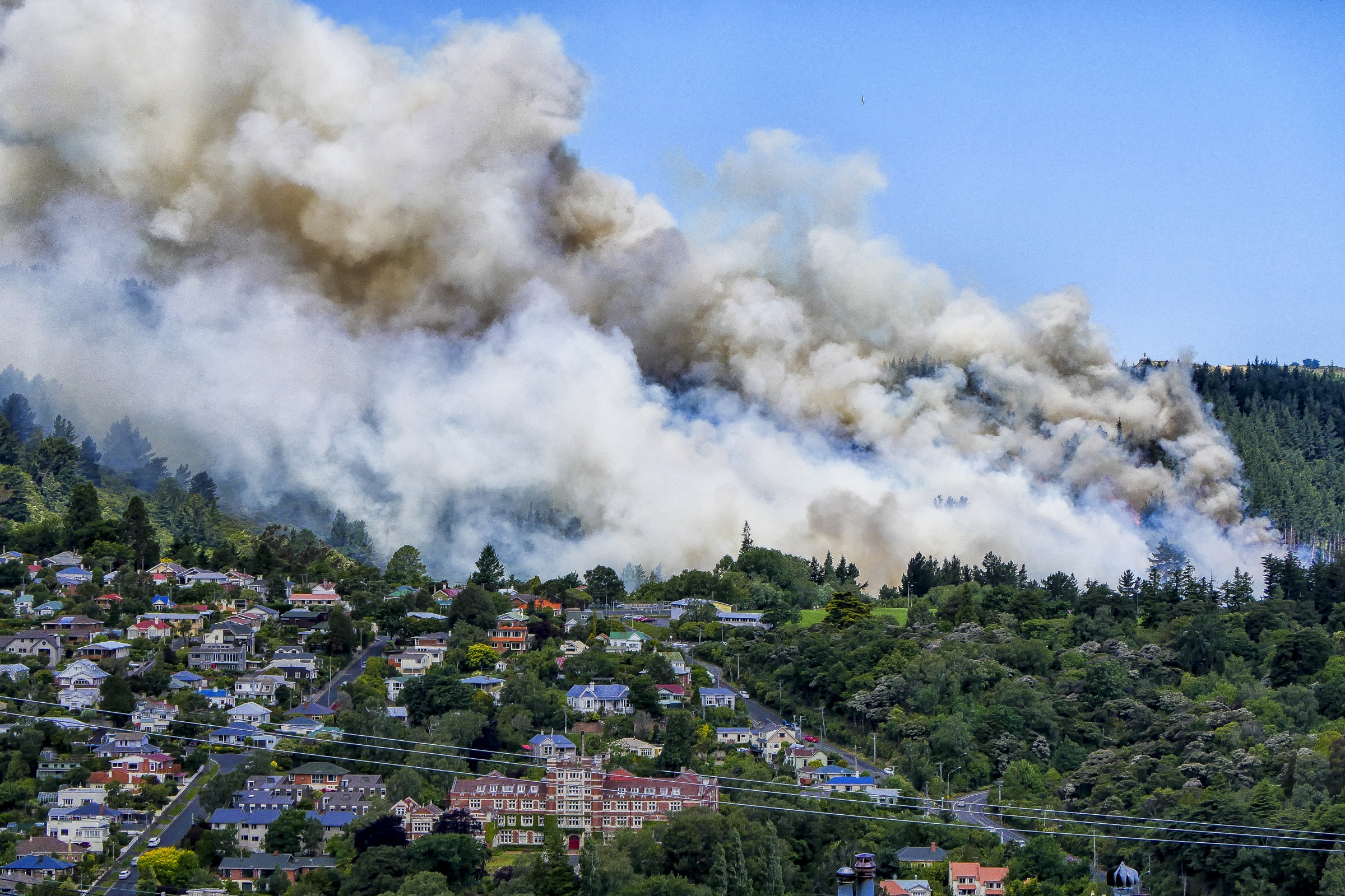 A huge smoke cloud rises from the fire at Signal Hill yesterday,  taken from Fortune St, Dalmore....