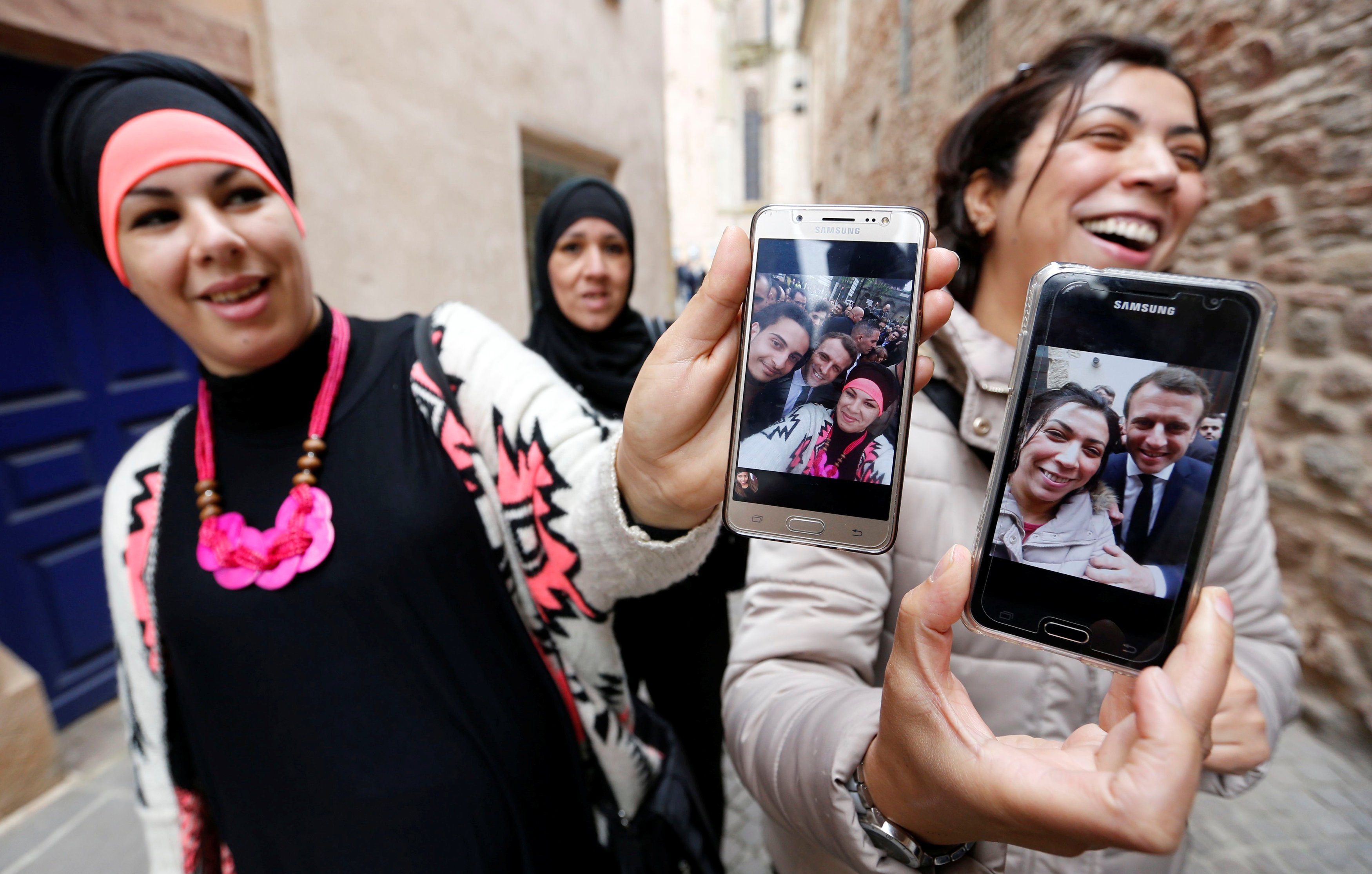 Supporters show their selfies with Emmanuel Macron, head of the political movement En Marche!, or Onwards!, during his French presidential campaign visit in Rodez at the weekend. Photo: Reuters.