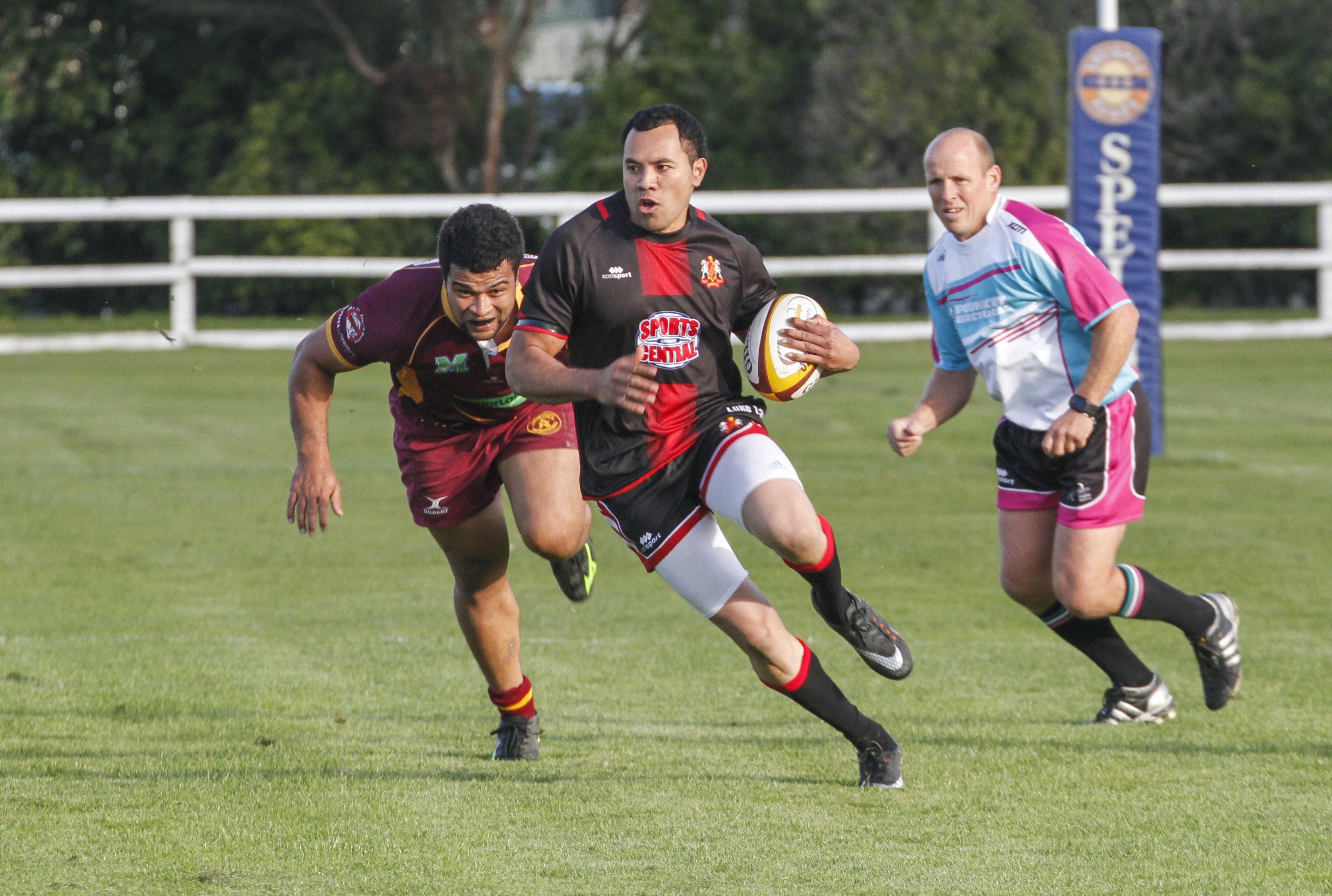 Old Boys winger Taani Vaitahi gets away from Athletic-Marist defender Malu Falepaini with referee...