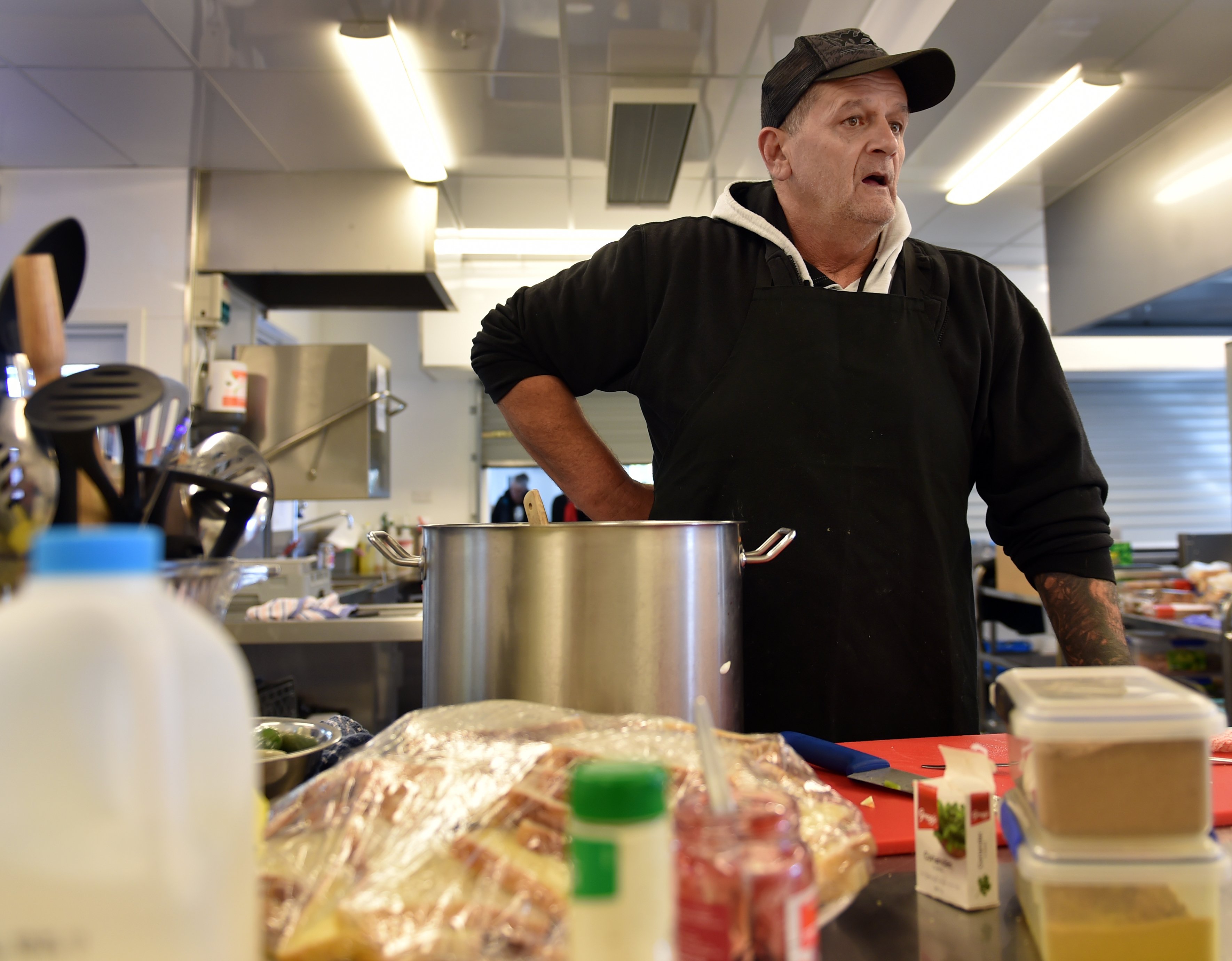 Wayne Frisby, of Dunedin, does some extra cooking at the Otakou marae kitchen. Photo: Peter...